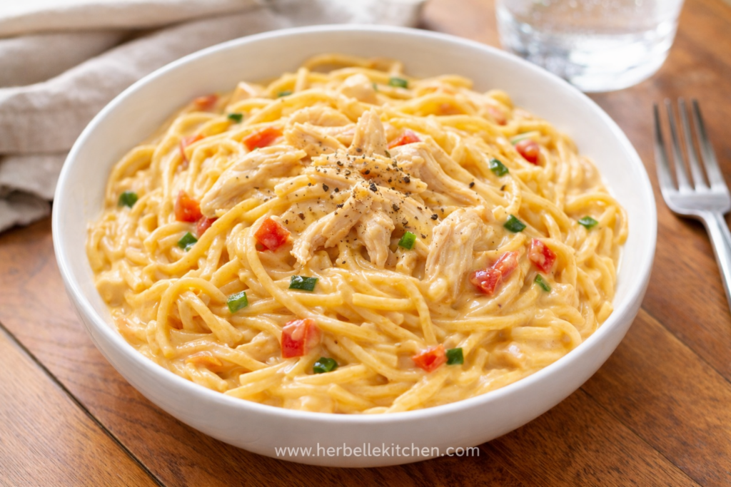 Some dinners just feel like a small victory. You toss a few ingredients into the slow cooker, walk away, and hours later—boom—your kitchen smells like you’ve been cooking all day. That’s exactly the magic behind this Creamy Chicken Spaghetti Recipe. It’s warm, cozy, ridiculously comforting, and somehow manages to taste like a full-on weekend meal… even when it’s a chaotic Tuesday night.This dish is a lifesaver when the day gets busy. Everything cooks right in the slow cooker, which means minimal effort and maximum flavor. Set it, forget it, and let the crockpot do the heavy lifting. By the time dinner rolls around, you’ve got tender chicken, perfectly cooked pasta, and a creamy, cheesy sauce that practically hugs every bite. No complicated steps, no fancy techniques—just a solid Chicken Spaghetti Recipe Crockpot families love.And let’s talk about the flavor boost. The secret hero here? Rotel. Those diced tomatoes and green chiles add just enough zip to balance the rich, creamy sauce. That’s why this dish fits perfectly into the world of Rotel Recipes—comfort food with a little extra personality.Even better, the prep takes about 10 minutes tops. Seriously. Toss in the ingredients, give it a quick stir, and move on with your day. IMO, recipes like this deserve a permanent spot in the dinner rotation. It’s no surprise people keep searching for Chicken Crockpot Recipes Easy enough to handle busy schedules but still deliver big flavor.The result is classic comfort food at its best: tender chicken, creamy sauce, and satisfying pasta all in one bowl. That’s why so many home cooks love recipes like Easy Chicken Spaghetti Recipe Crockpot meals and other cozy Chicken Spaghetti Recipes that come together without the stress.And honestly? Once you try this Crockpot Chicken Spaghetti, you might start looking for excuses to make more Crockpot Pasta dinners. FYI—leftovers are even better the next day.